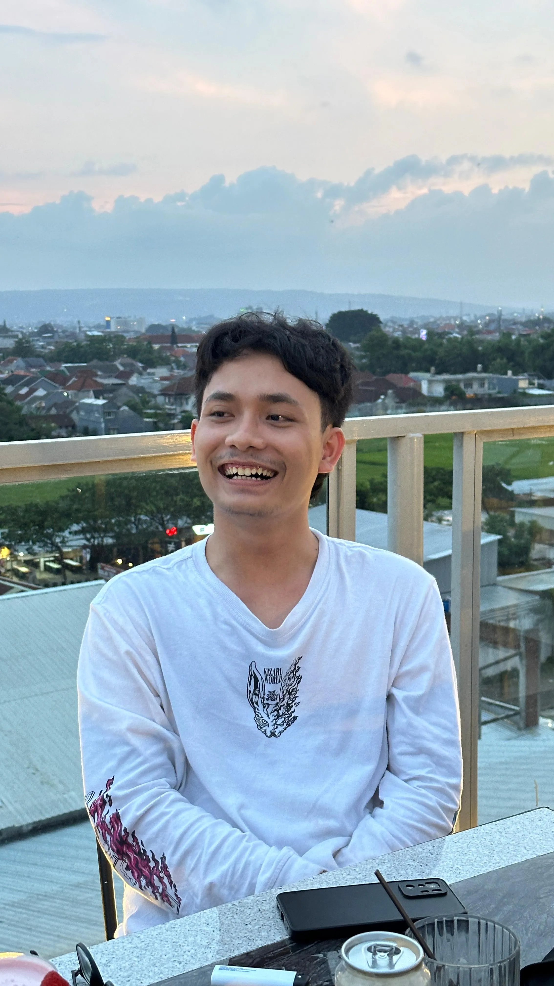 Khafid Prayoga sitting in a coffee shop